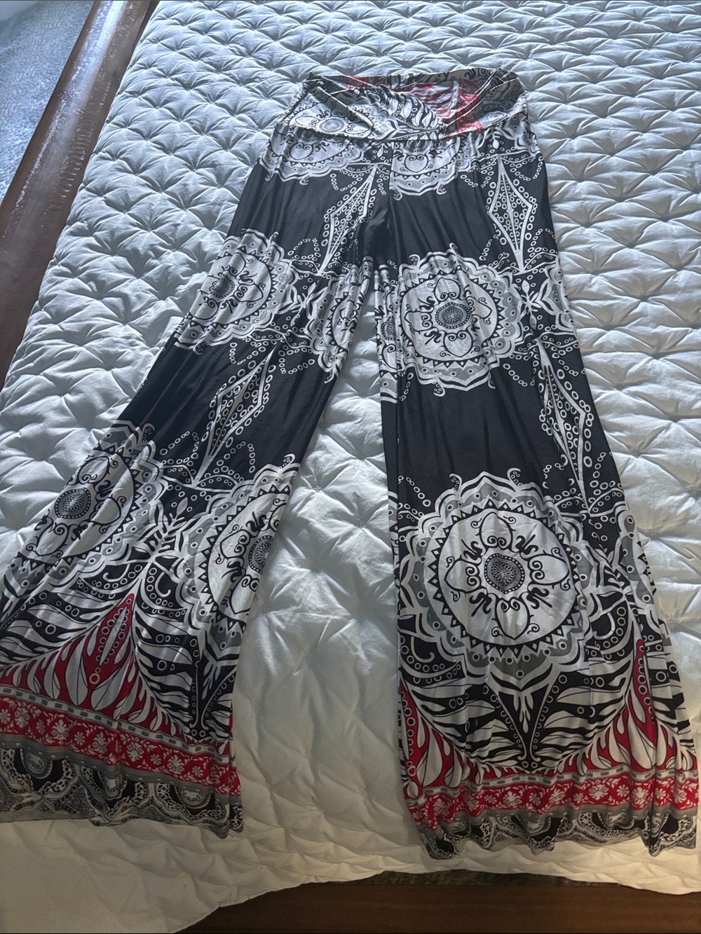 Women’s Black & White Printed Wide-Leg Pants with Red Accents.